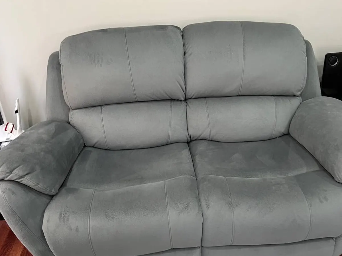 A grey two-seat loveseat