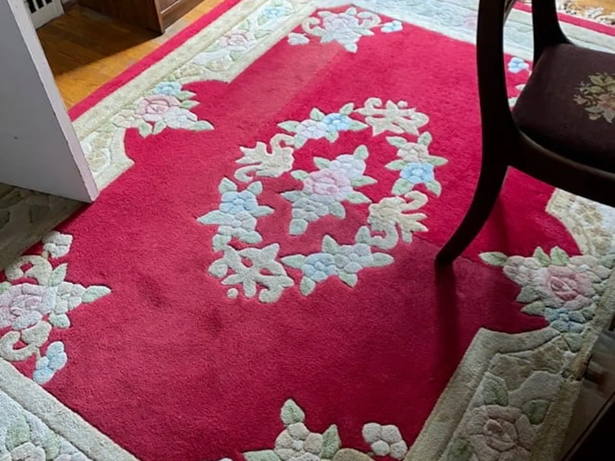 A wool Aubusson-style area rug cleaned in place