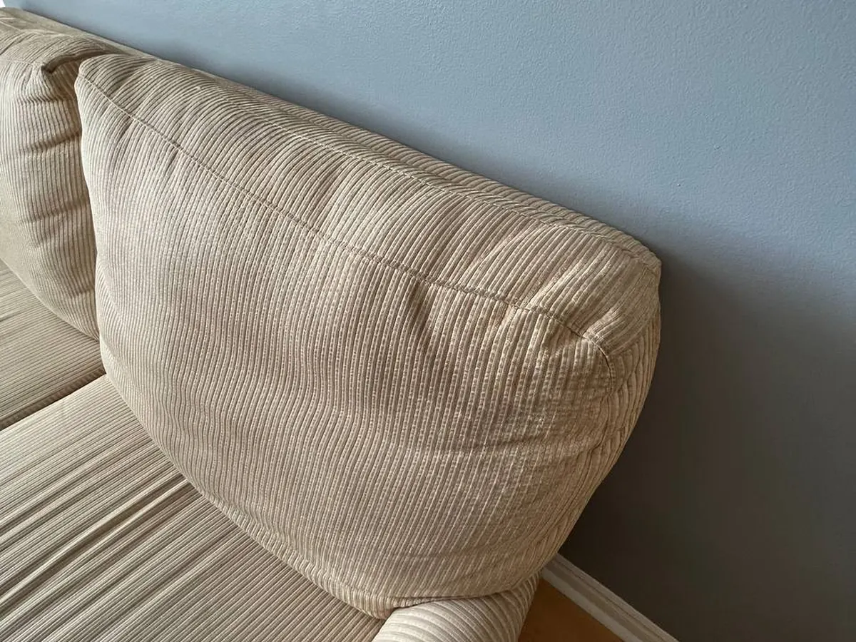 Close-up of a sofa arm and seam