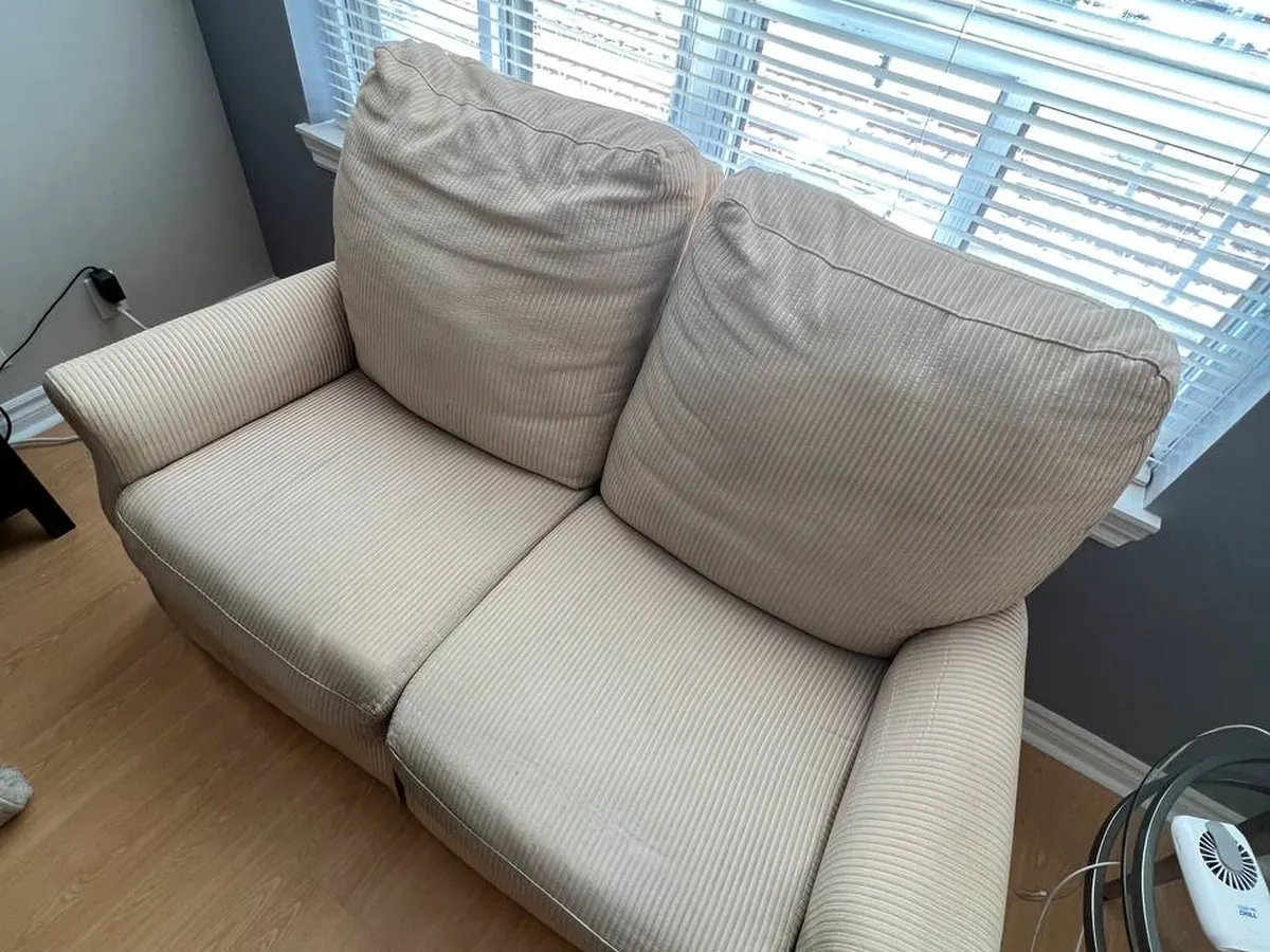 A cream three-seat sofa