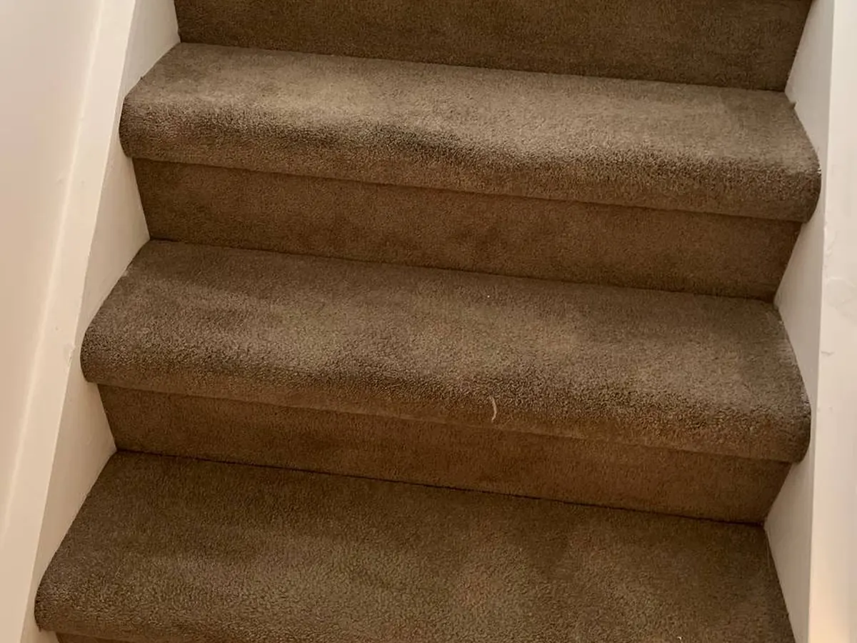A second staircase showing worn traffic lanes